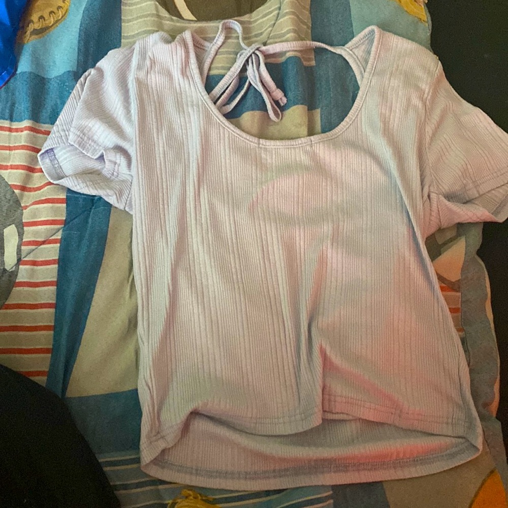 blue shirt with tie in the back